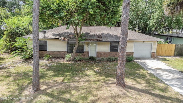 7413 Ester Rd, Cocoa, FL 32927 - ranch-style house with a garage, brick siding, driveway, and roof with shingles