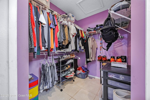 402 Ainsley St SE, Palm Bay, FL 32909 - spacious closet featuring attic access and tile patterned flooring