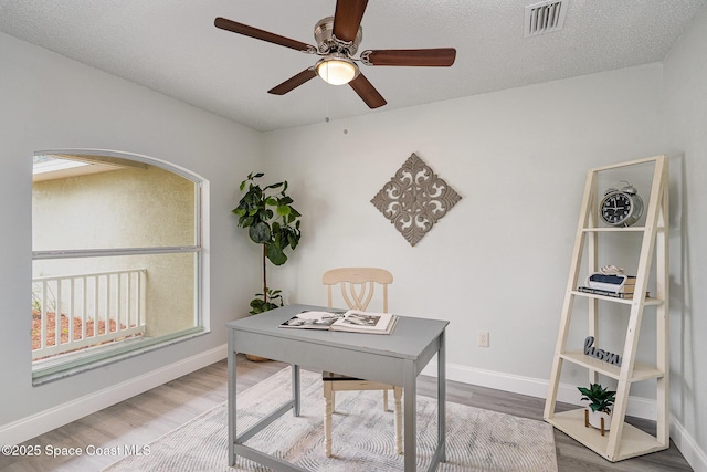 542 White Plains Ave SW, Palm Bay, FL 32908 - home office with wood finished floors, ceiling fan, baseboards, and arched walkways