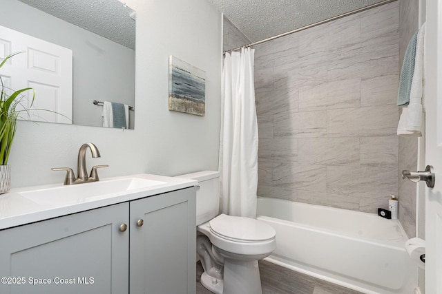 542 White Plains Ave SW, Palm Bay, FL 32908 - bathroom with toilet, a textured ceiling, vanity, shower / tub combo, and wood finished floors