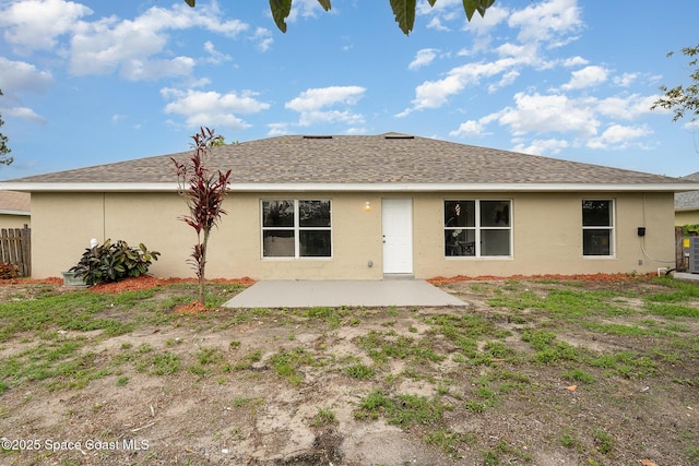 542 White Plains Ave SW, Palm Bay, FL 32908 - back of house featuring a patio, stucco siding, and a shingled roof