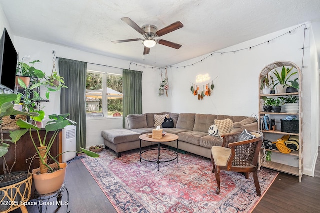 209 Plumosa Dr, Cocoa, FL 32922 - living area with wood finished floors and ceiling fan