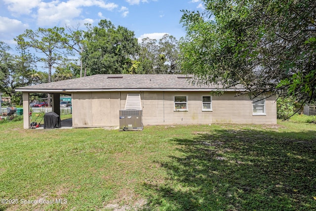 209 Plumosa Dr, Cocoa, FL 32922 - rear view of house featuring a lawn