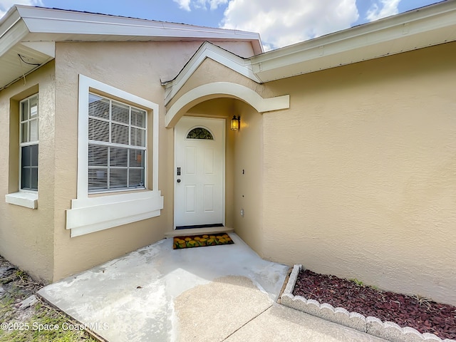 10360 Crystal Point Dr, Orlando, FL 32825 - view of exterior entry featuring stucco siding