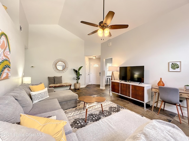 10360 Crystal Point Dr, Orlando, FL 32825 - living area with a ceiling fan, high vaulted ceiling, baseboards, and stone finish floors
