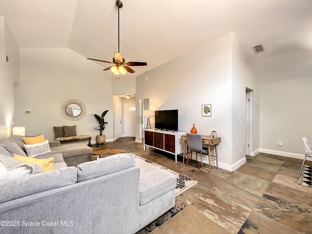 10360 Crystal Point Dr, Orlando, FL 32825 - living area with high vaulted ceiling, baseboards, and ceiling fan