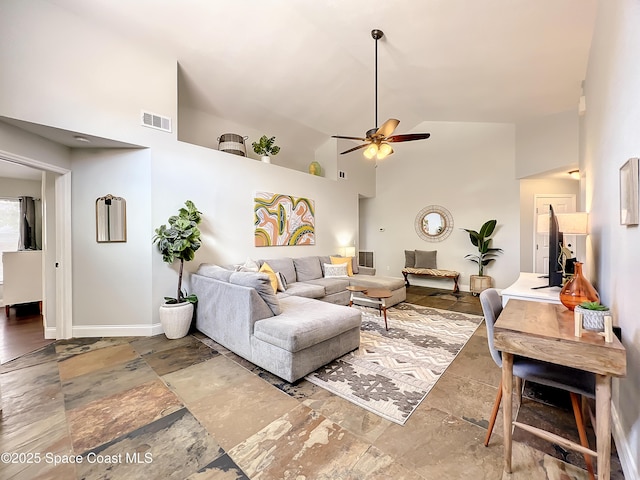 10360 Crystal Point Dr, Orlando, FL 32825 - living area featuring high vaulted ceiling, stone tile floors, a ceiling fan, and baseboards