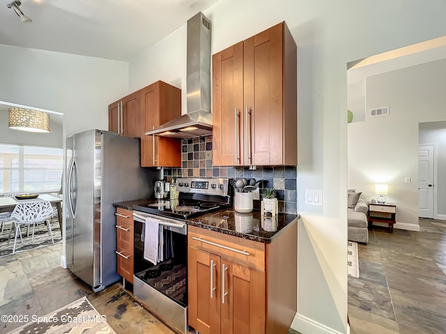 10360 Crystal Point Dr, Orlando, FL 32825 - kitchen with stainless steel appliances, wall chimney range hood, backsplash, stone finish flooring, and dark stone counters