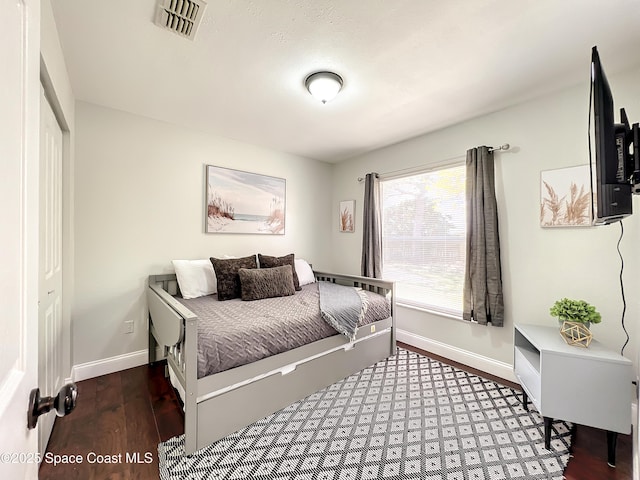 10360 Crystal Point Dr, Orlando, FL 32825 - bedroom featuring baseboards and wood finished floors