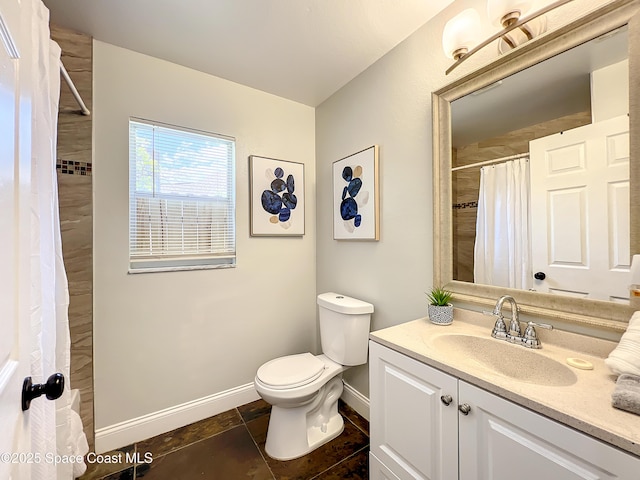 10360 Crystal Point Dr, Orlando, FL 32825 - full bathroom featuring baseboards, toilet, vanity, a shower with shower curtain, and tile patterned flooring