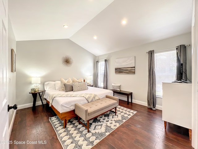 10360 Crystal Point Dr, Orlando, FL 32825 - bedroom with lofted ceiling, dark wood-type flooring, baseboards, and recessed lighting