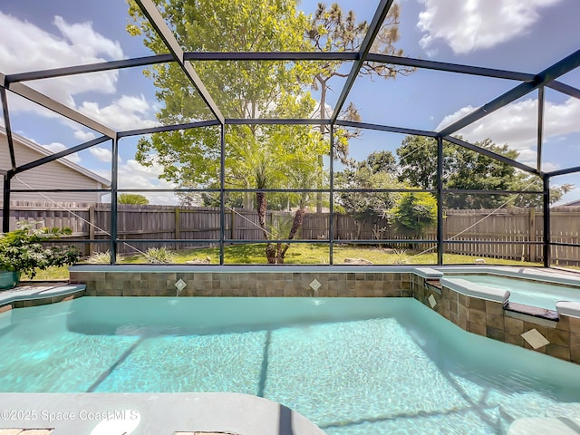 10360 Crystal Point Dr, Orlando, FL 32825 - view of pool featuring a fenced backyard, a pool with connected hot tub, and a lanai