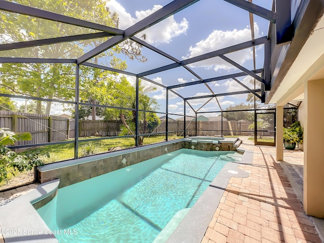 10360 Crystal Point Dr, Orlando, FL 32825 - view of swimming pool featuring a fenced backyard, a patio area, a pool with connected hot tub, and glass enclosure