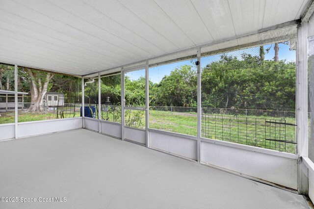 1123 Hermosa Dr, Rockledge, FL 32955 - unfurnished sunroom with view of scattered trees