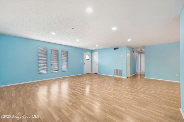 1123 Hermosa Dr, Rockledge, FL 32955 - unfurnished living room with recessed lighting, light wood-type flooring, and baseboards