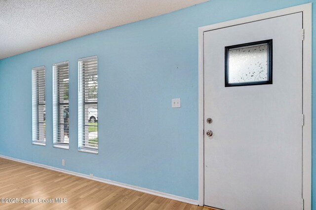 1123 Hermosa Dr, Rockledge, FL 32955 - interior space featuring light wood-style floors and baseboards