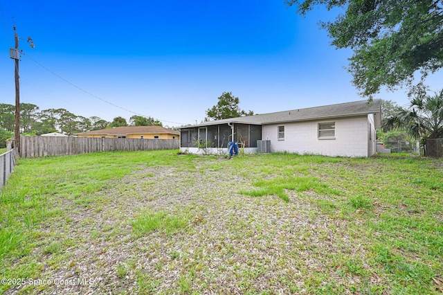 1123 Hermosa Dr, Rockledge, FL 32955 - view of yard with a sunroom and central air condition unit