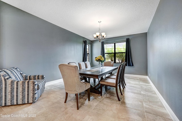 7406 Millbrook Ave, Melbourne, FL 32940 - dining space with a chandelier and a textured ceiling