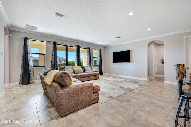 7406 Millbrook Ave, Melbourne, FL 32940 - living room with arched walkways, ornamental molding, recessed lighting, and a textured ceiling