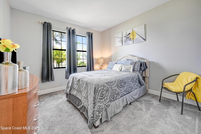 7406 Millbrook Ave, Melbourne, FL 32940 - bedroom featuring carpet floors and a textured ceiling
