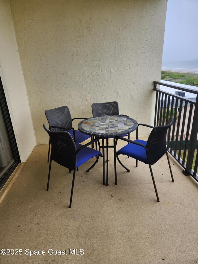 3060 N Atlantic Ave Unit 602, Cocoa Beach, FL 32931 - balcony featuring outdoor dining area