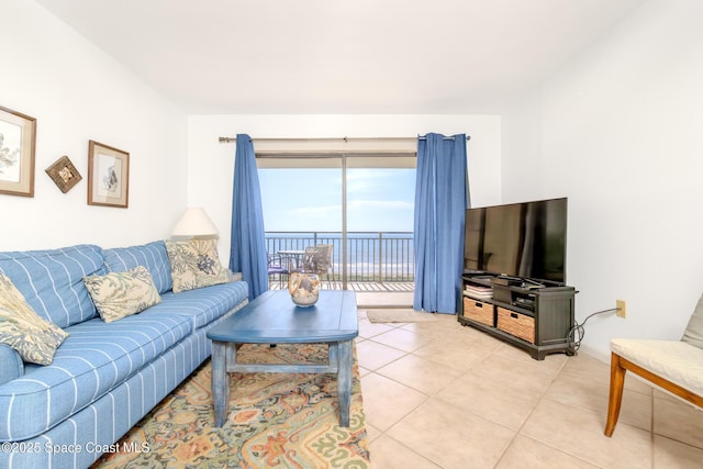 3060 N Atlantic Ave Unit 602, Cocoa Beach, FL 32931 - living room featuring light tile patterned floors
