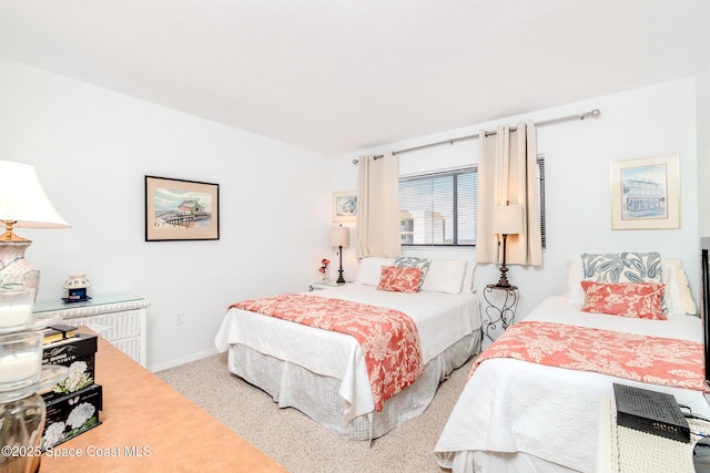 3060 N Atlantic Ave Unit 602, Cocoa Beach, FL 32931 - bedroom featuring carpet floors and baseboards