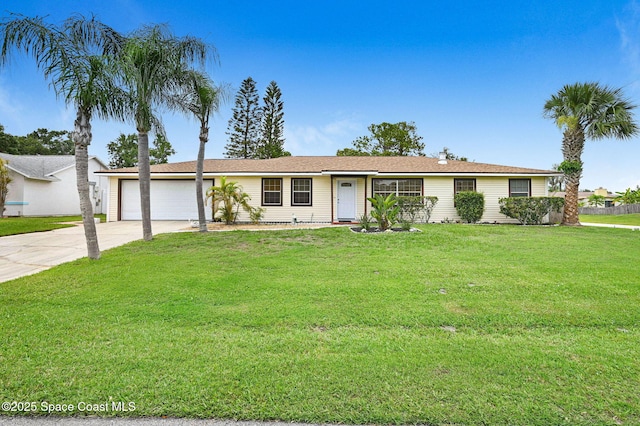 409 Stendal Rd NW, Palm Bay, FL 32907 - ranch-style home with driveway, a garage, and a front lawn