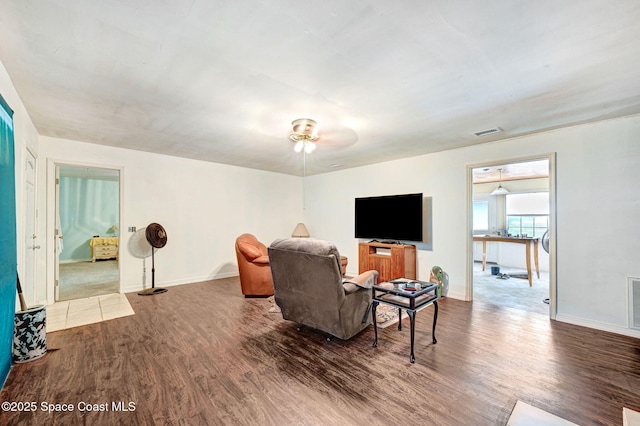 409 Stendal Rd NW, Palm Bay, FL 32907 - living area featuring wood finished floors, ceiling fan, and baseboards