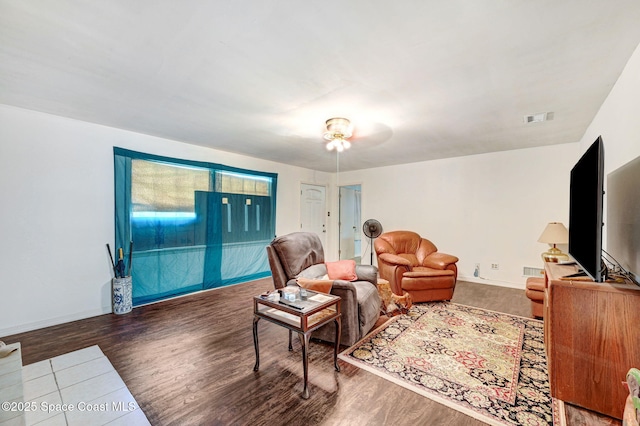 409 Stendal Rd NW, Palm Bay, FL 32907 - living area featuring wood finished floors, baseboards, and ceiling fan