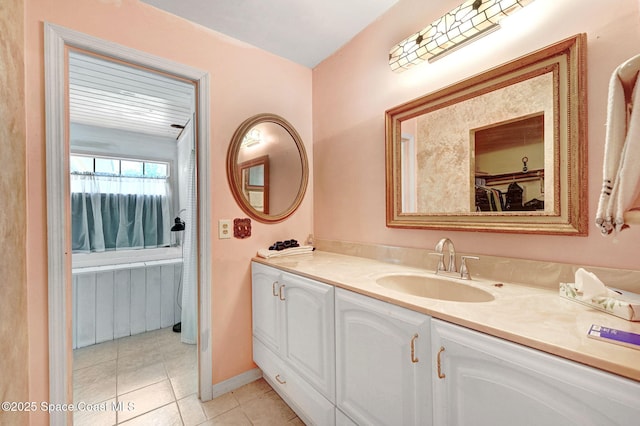 409 Stendal Rd NW, Palm Bay, FL 32907 - bathroom with tile patterned floors, vanity, and baseboards