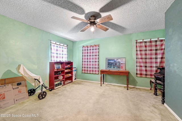 409 Stendal Rd NW, Palm Bay, FL 32907 - playroom with carpet, ceiling fan, a textured ceiling, and baseboards