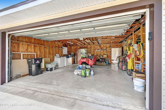 409 Stendal Rd NW, Palm Bay, FL 32907 - garage featuring washing machine and clothes dryer