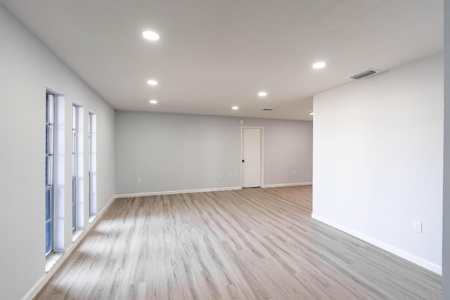 306 Harvey Ave NE, Palm Bay, FL 32907 - empty room featuring recessed lighting, light wood-style floors, and baseboards