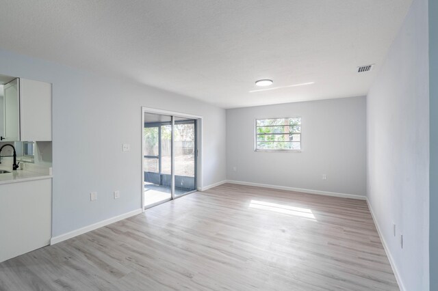 306 Harvey Ave NE, Palm Bay, FL 32907 - spare room with light wood finished floors and baseboards