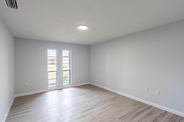 306 Harvey Ave NE, Palm Bay, FL 32907 - empty room with light wood-style floors and baseboards