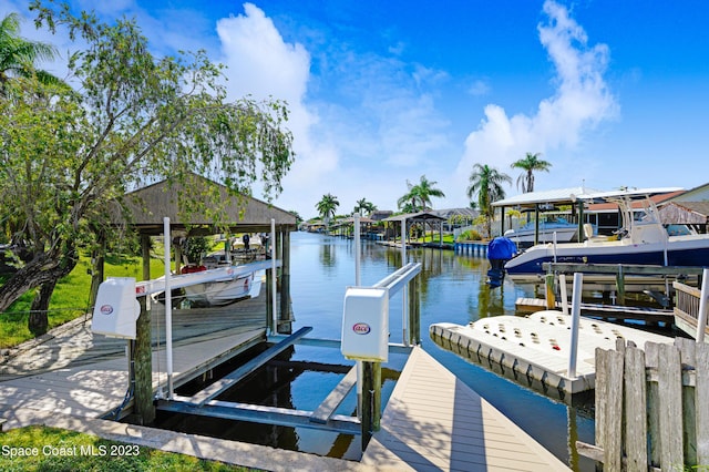 1455 Centaurus Ct, Merritt Island, FL 32953 - dock area featuring boat lift and a water view