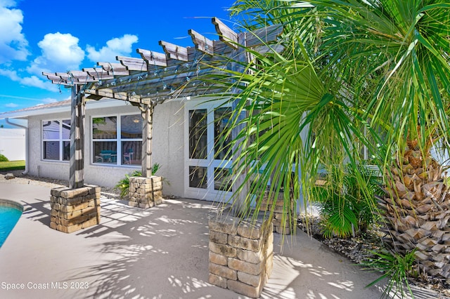 1455 Centaurus Ct, Merritt Island, FL 32953 - view of patio / terrace with a pergola and an outdoor pool