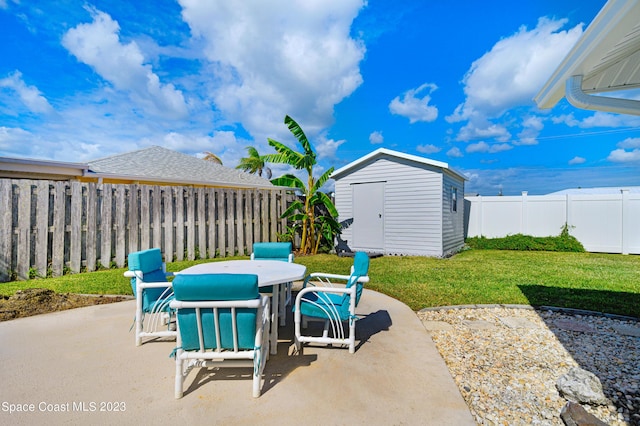 1455 Centaurus Ct, Merritt Island, FL 32953 - fenced backyard with outdoor dining area, a patio area, and a shed