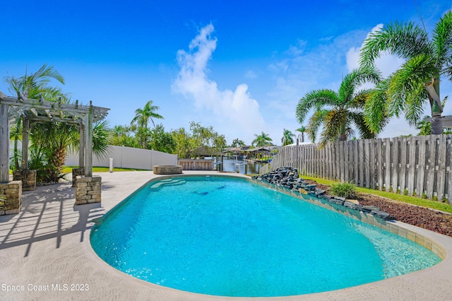 1455 Centaurus Ct, Merritt Island, FL 32953 - view of pool with a pergola, a patio area, and a fenced backyard