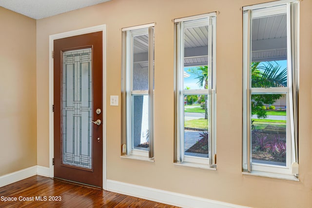 1455 Centaurus Ct, Merritt Island, FL 32953 - entrance foyer featuring dark wood-type flooring and baseboards