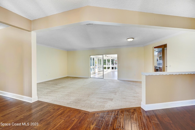 1455 Centaurus Ct, Merritt Island, FL 32953 - carpeted empty room with hardwood / wood-style flooring and ornamental molding