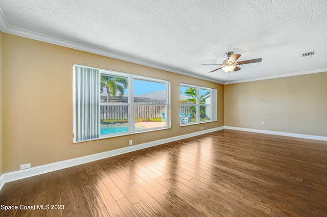 1455 Centaurus Ct, Merritt Island, FL 32953 - empty room with plenty of natural light, a textured ceiling, crown molding, a ceiling fan, and wood finished floors