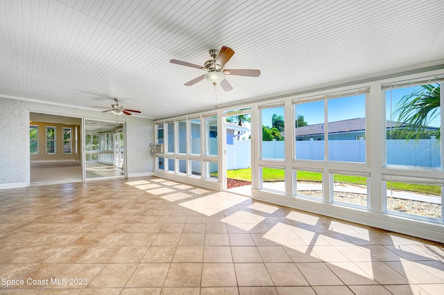 1455 Centaurus Ct, Merritt Island, FL 32953 - unfurnished sunroom with plenty of natural light and tile patterned flooring