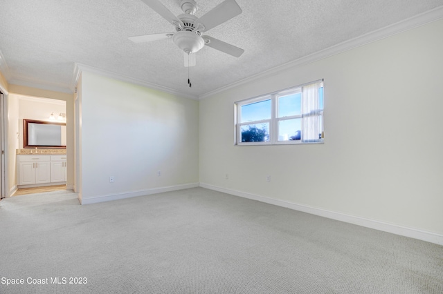 1455 Centaurus Ct, Merritt Island, FL 32953 - spare room featuring ornamental molding, light carpet, a textured ceiling, and ceiling fan