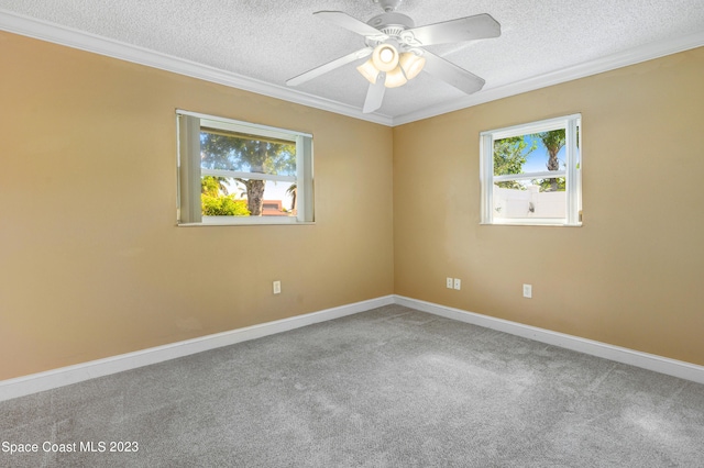 1455 Centaurus Ct, Merritt Island, FL 32953 - empty room featuring a textured ceiling, ornamental molding, plenty of natural light, carpet floors, and a ceiling fan