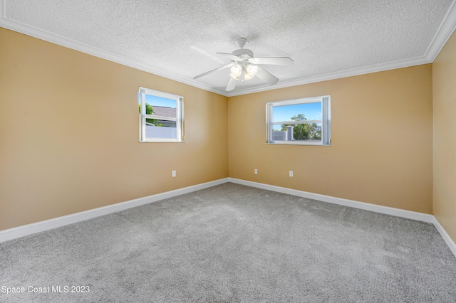 1455 Centaurus Ct, Merritt Island, FL 32953 - spare room featuring plenty of natural light, ornamental molding, a textured ceiling, a ceiling fan, and carpet flooring