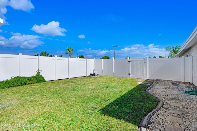 1455 Centaurus Ct, Merritt Island, FL 32953 - fenced backyard with a gate