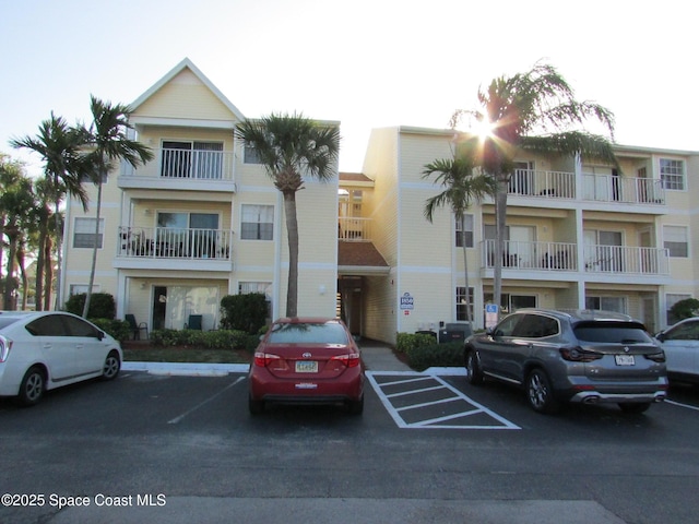 1850 Charlesmont Dr Unit 7118, Melbourne, FL 32903 - view of building exterior with uncovered parking