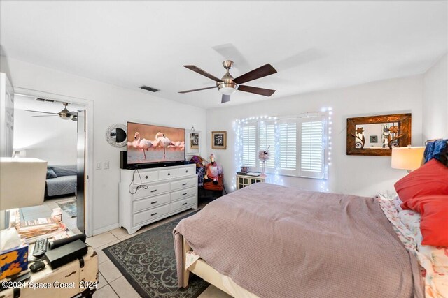 190 Shell Pl Unit 84, Rockledge, FL 32955 - bedroom with light tile patterned floors and ceiling fan